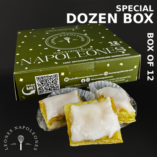 Box of Leones Napoleones with three pieces on a black background