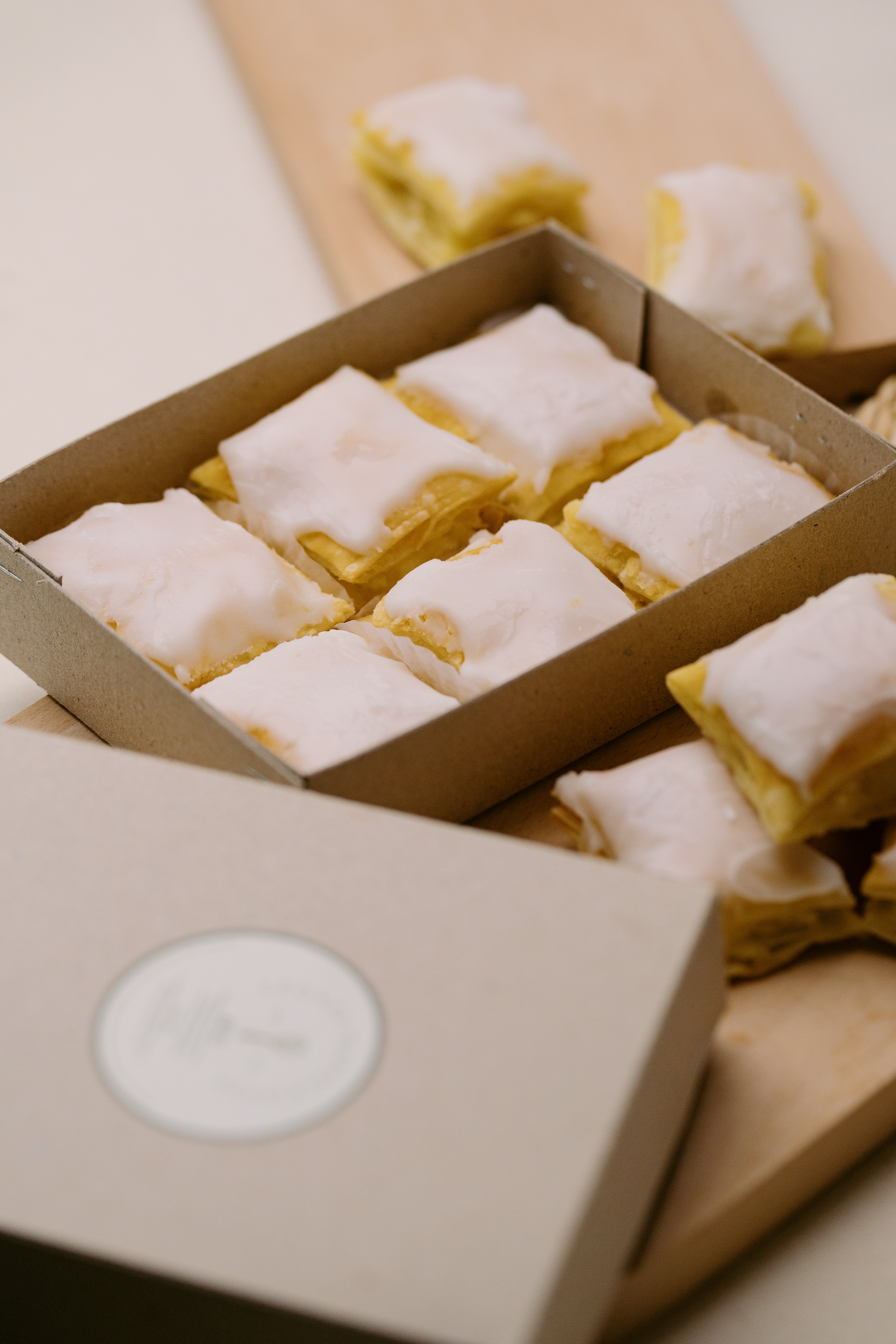 Close-up of flaky glazed Napoleones in the 6-piece Tasting Box